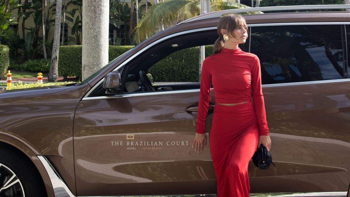 A girl arriving by a car at Brazilian Court